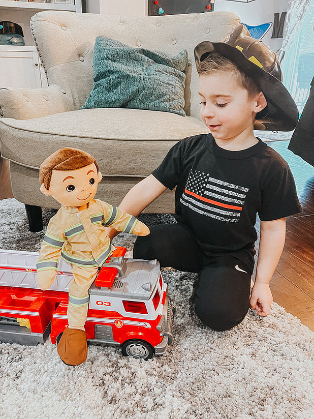 Boy and firefighter doll